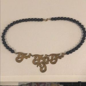 Gold and lava rock necklace